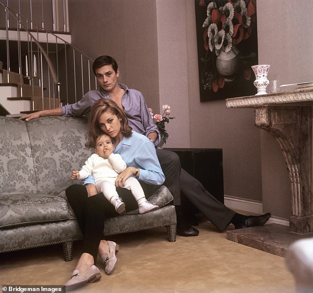 Alain Delon, at home in Paris, with his wife Nathalie (Francine Canovas) and his son Anthony Delon in 1964