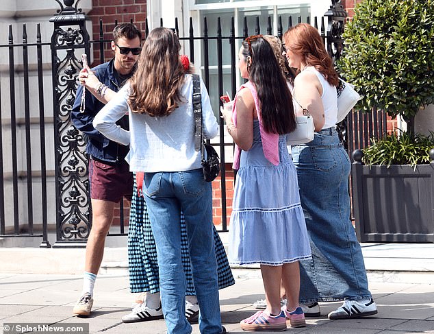 Harry made the most of the British summer on Sunday as he was spotted soaking up the sun in shorts before being mobbed by fans