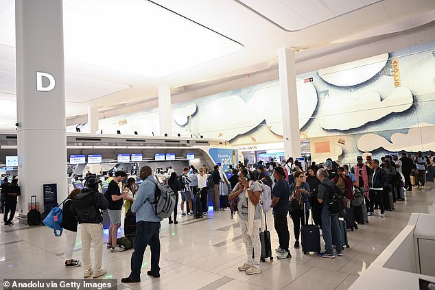 Passengers at LaGuardia Airport wait for flights to resume. Hundreds of planes were grounded due to heavy rain in New York City, United States on August 19, 2024