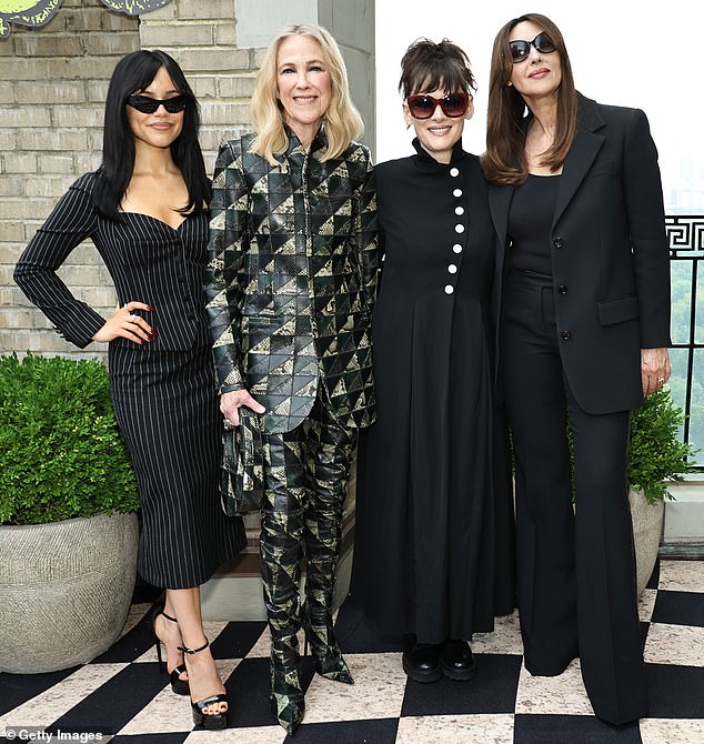 This past weekend, Jenna was seen in a black pinstripe Dolce & Gabbana skirt suit for a Beetlejuice photo shoot; photographed with co-stars Catherine O'Hara, Winona Ryder and Monica Bellucci