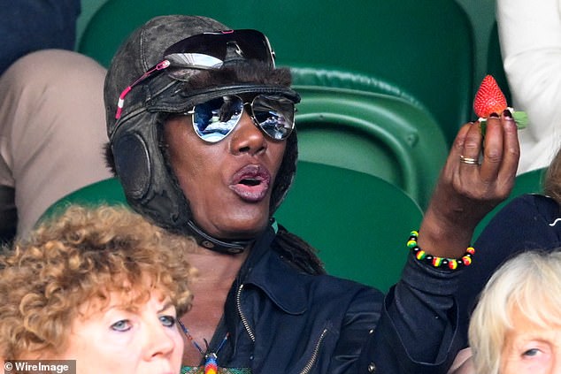 Grace Jones enjoys a strawberry during the second day of Wimbledon Tennis on July 2