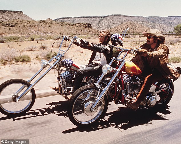 American actors Dennis Hopper and Peter Fonda ride through the desert on motorcycles in a scene from the film 'Easy Rider'