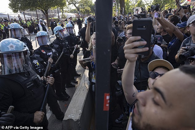 Protesters breached the DNC's outer barricade and swarmed the area before being pushed back by authorities.