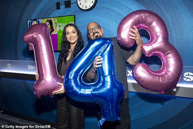 She also posed with SiriusXM Radio DJ Tony Fly holding up balloons that read 