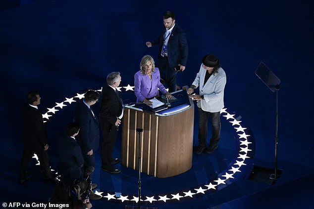 Jill Biden performs a podium check ahead of her speech on Monday