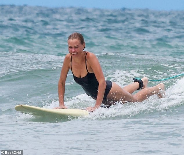 She could be seen as someone who was having the time of her life as she braved the waves in Central America and showed off her incredible skills on a board