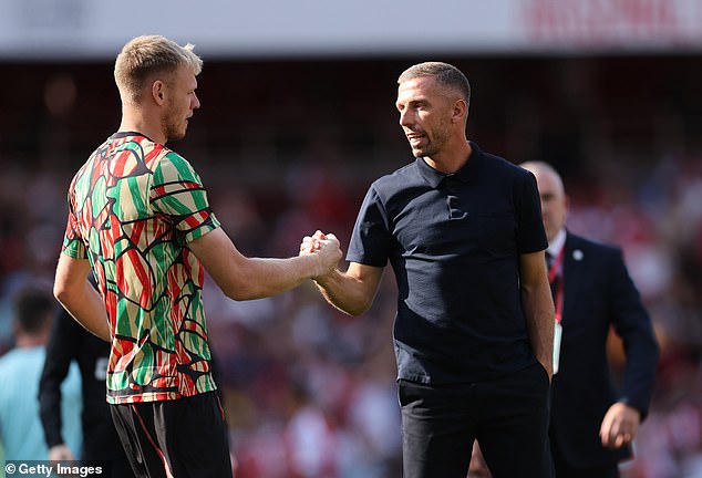 Ramsdale was on the bench against Wolves and was seen greeting Gary O'Neil before kick-off