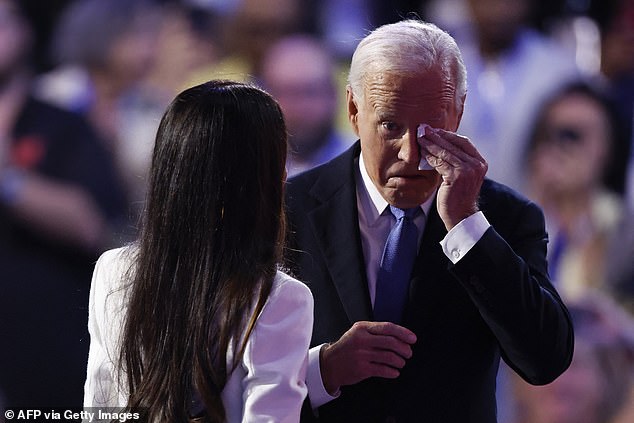 President Joe Biden (R) wipes away a tear as he arrives in Chicago Monday night to deliver his swan song speech at the Democratic National Convention. He was introduced by his eldest daughter, Ashley Biden (L).