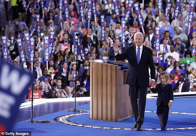 President Joe Biden (left) walks offstage with baby Beau (right) after his speech at the Democratic National Convention Monday night. He's headed to California for the rest of the week