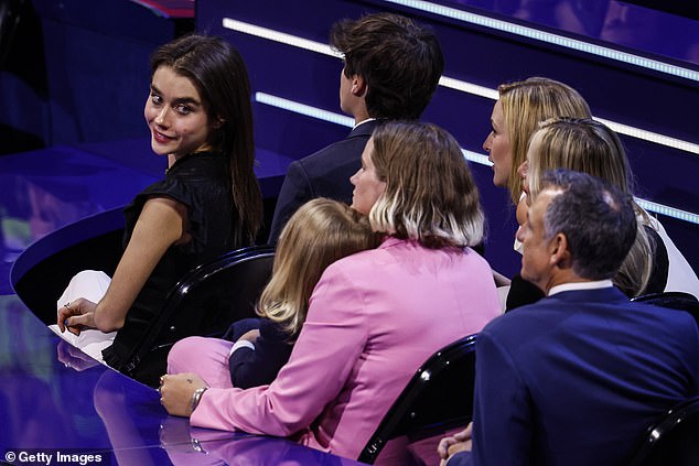 Natalie Biden (left), one of the president's grandchildren, sits next to her brother Hunter and looks back at her niece Maisy Biden and baby Beau