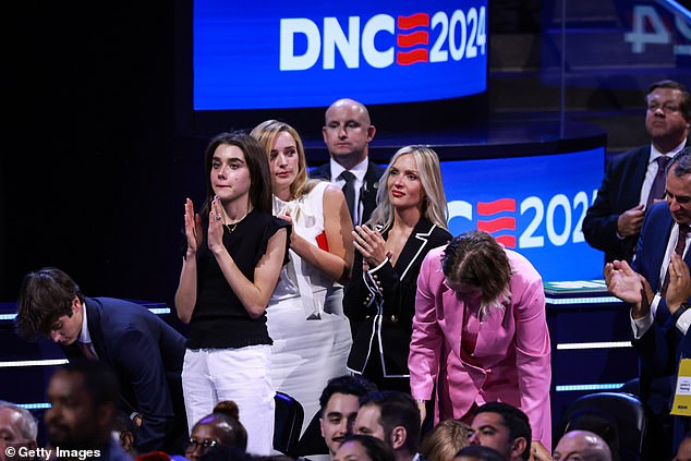 From left: Natalie Biden, Finnegan Biden, Melissa Cohen and Maisy Biden stand and applaud ahead of President Joe Biden's appearance Monday night at the Democratic National Convention