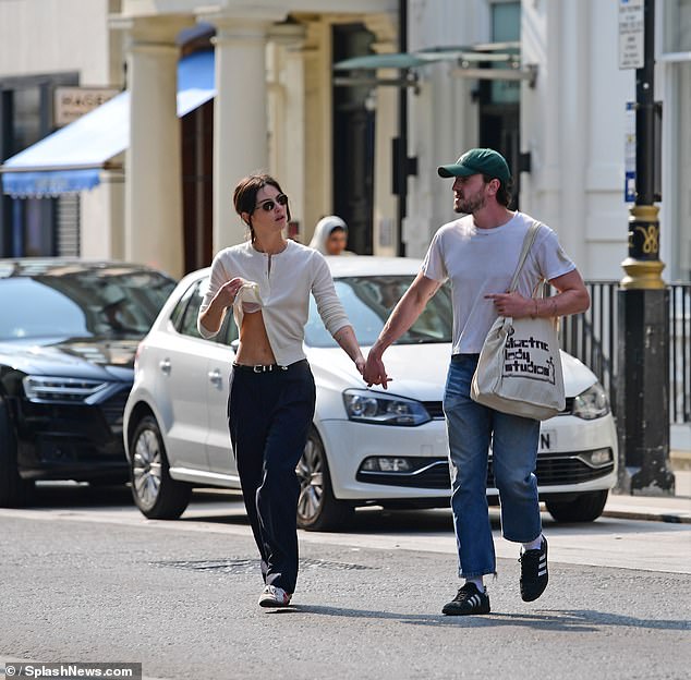 Meanwhile, Close To You singer Gracie nailed casual chic in an elegant cream cardigan, with the performer at one point giving a glimpse of her white lace bra as she lifted up her top