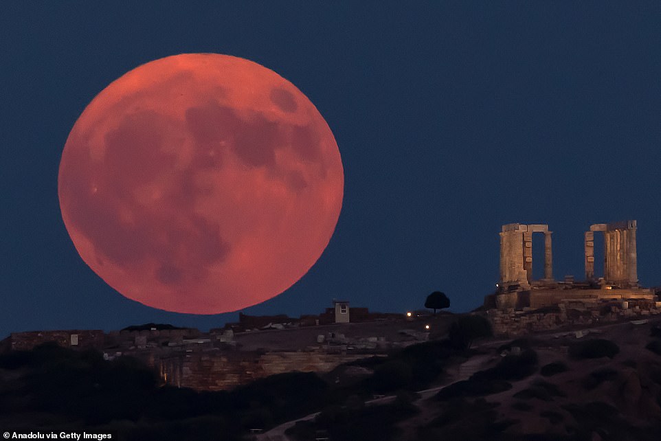 ATHENS: The full moon, also called the blue moon, rises over the Temple of Poseidon at Cape Sounion near Athens