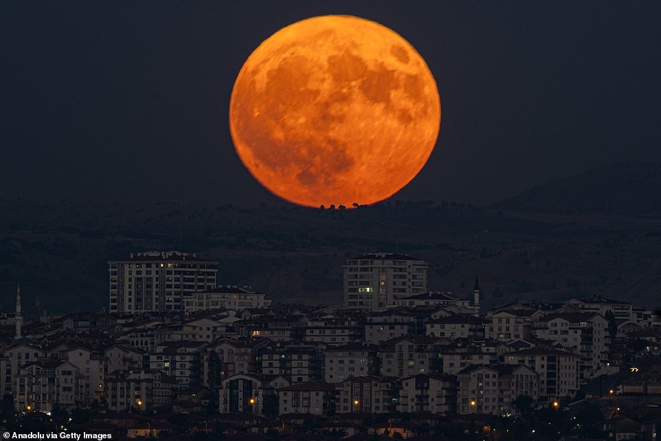 TURKEY: Supermoon rises over buildings in Ankara, Turkey on August 19. There won't be another one until 2037