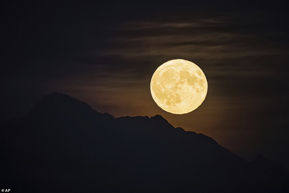 SWITZERLAND: A so-called blue supermoon rises over the 