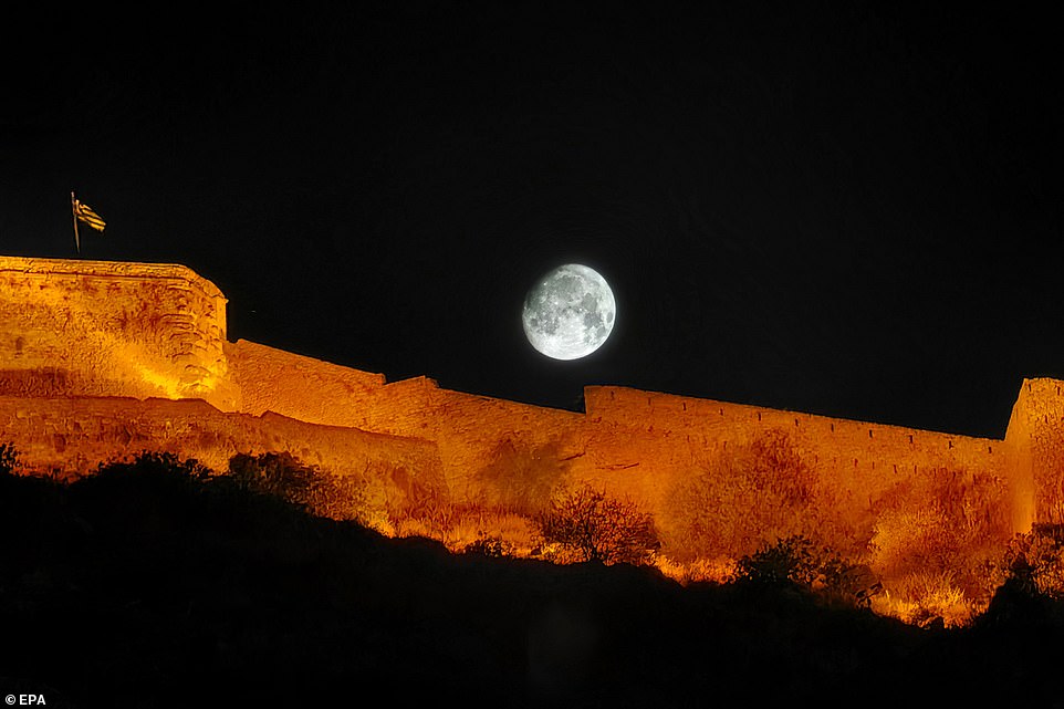 GREECE: The first supermoon of the year, also known as the Sturgeon Moon, rises over Palamidi Castle in Nafplio, Peloponnese, Greece