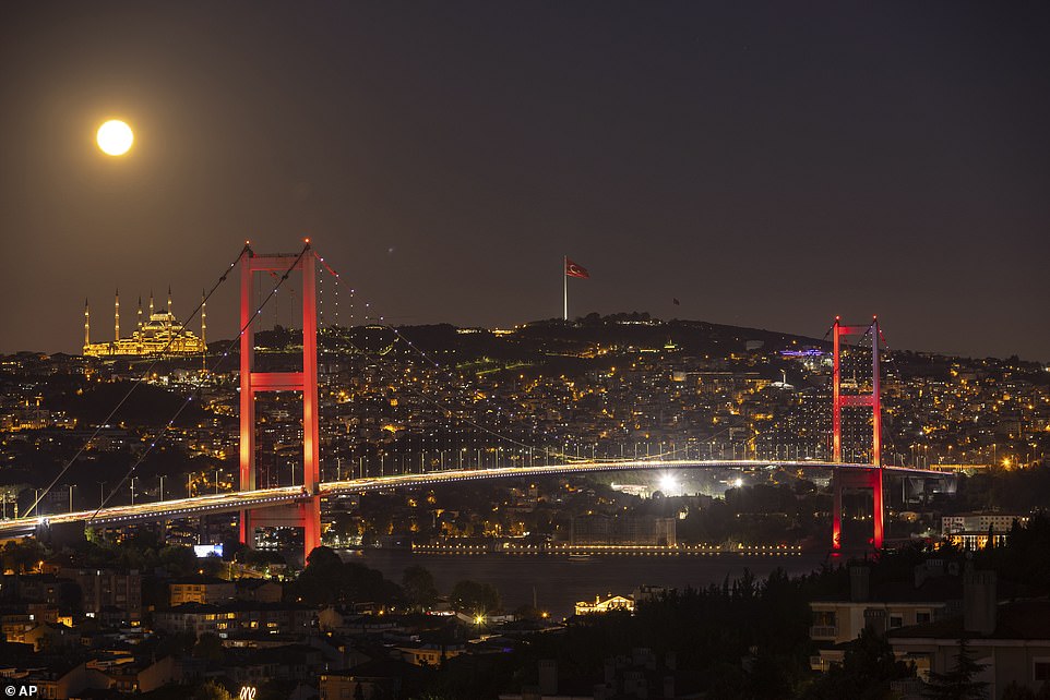 ISTANBUL: The phenomenal moon rises behind the Camlica Mosque and Martyrs Bridge in Istanbul, Turkey