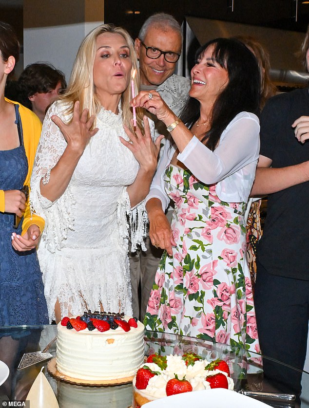 Brooke's mother Moira playfully held up a candle for her to blow out and make a wish