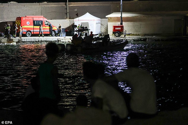 Experienced deep sea cave divers continue the rescue operation for missing persons aboard a sailboat that sank off the coast of Porticello, near Palermo, Sicily, Italy