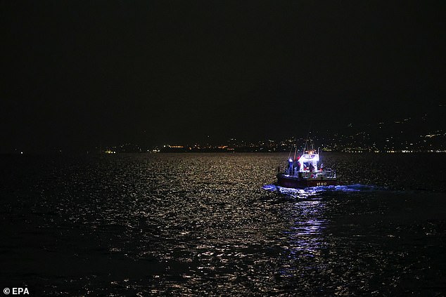 Experienced deep sea cave divers continue the rescue operation for missing persons who were aboard a sailboat that sank off the coast of Porticello, near Palermo, Sicily, Italy, August 19