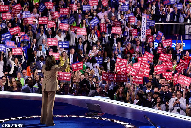 Delegates and supporters are pictured cheering on Kamala Harris as she takes the stage at the DNC at the United Center in Chicago on Monday night