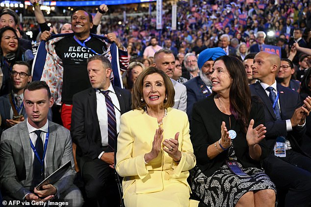 Pelosi is seen clapping and cheering during the first day of the Democratic National Convention in Chicago