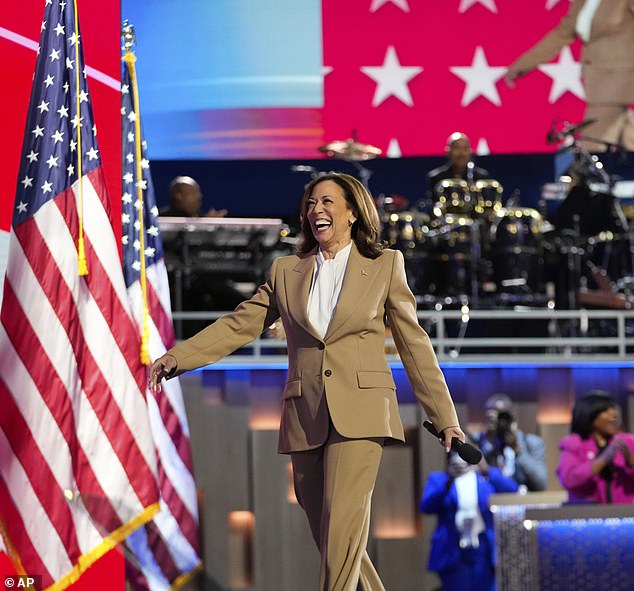 Kamala Harris, smiling and seemingly beaming with joy, takes the stage at the DNC on Monday