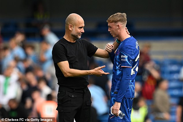 Pep Guardiola (left) was interestingly spotted chatting to Palmer during Saturday's match, after the Chelsea forward left Man City to join Chelsea last year