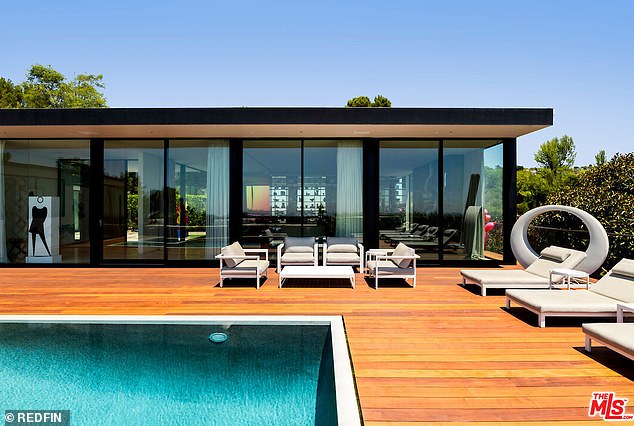 The backyard offers ample space to lounge in the California sun and enjoy views of Beverly Hills from a vantage point