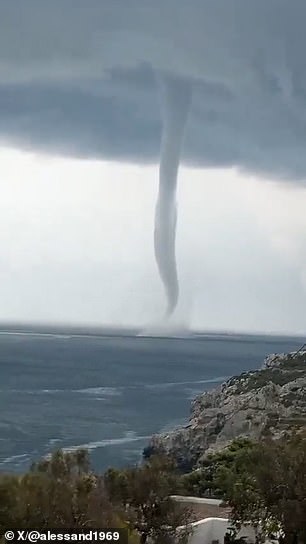 A towering waterspout was captured on camera off the coast of Salento