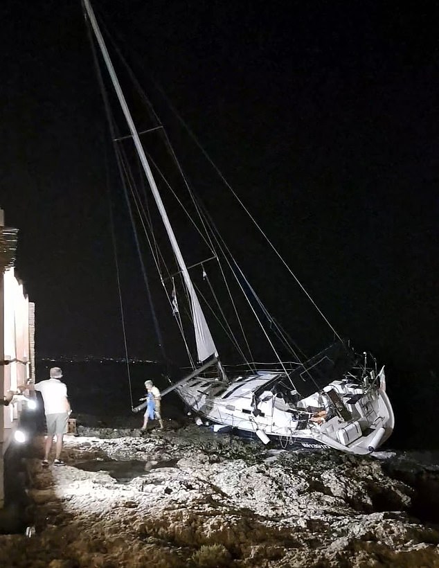 In the Gulf of Brucoli in southern Sicily, locals shared photos of a sailboat stranded on rocks after being swept away by strong winds