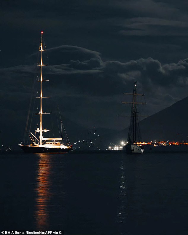 This photo shows the luxury superyacht named The Bayesian (left) off the coast of Porticello, Palermo, the night before it was hit by the storm