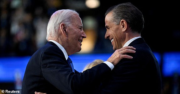 U.S. President Joe Biden greets his son Hunter Biden at the Democratic National Convention (DNC) in Chicago, Illinois, U.S., August 19, 2024. REUTERS/Craig Hudson TPX IMAGES OF THE DAY