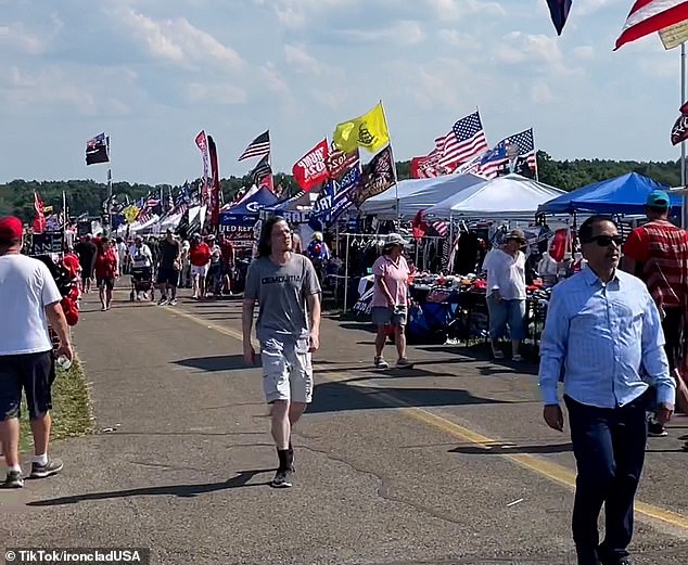 Crooks was filmed as the camera panned from the stall, which sold politically-tinged hats and t-shirts, across the fairground to show how busy it was