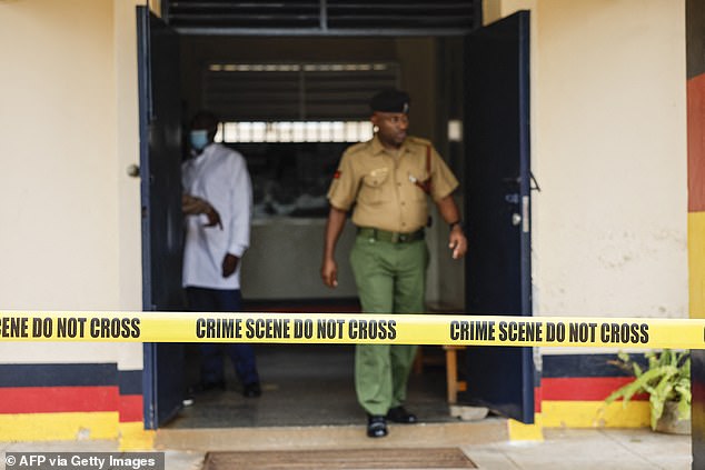 Detectives work on the scene at Gigiri police station after the escape