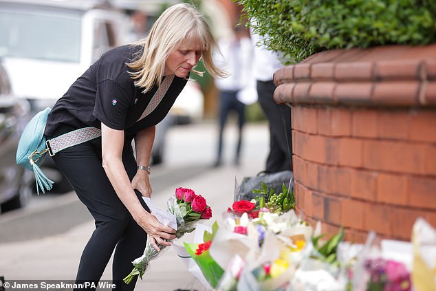 Bebe King, six, Alice Dasilva Aguiar, nine, and Elsie Dot Stancombe, seven, were killed during a Swift dance class on July 29, while 10 others were also injured (A person lays flowers nearby)