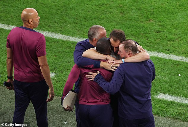 Two senior analysts under Southgate will not be part of the upcoming senior camp, it has been reported (pictured: Southgate embraces his staff members after the win over Slovakia this summer)