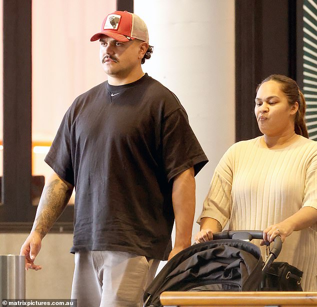 The embattled Souths star wore a straight face as he stepped out with his regular partner, Brielle Mercy (pictured together)