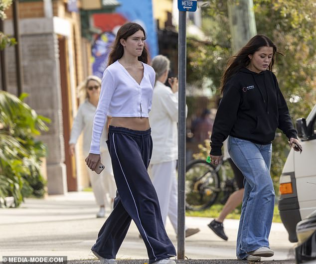 Phoenix (pictured right) was also dressed in casual fashion in a dark blue sweater and a pair of loose-fitting light blue jeans