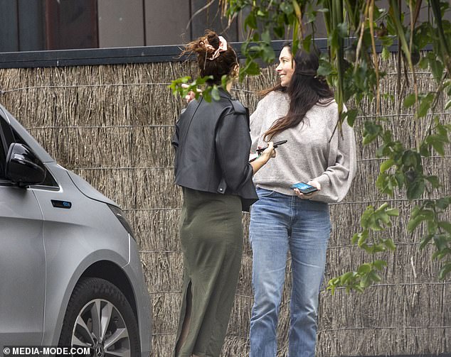 The brunette beauty looked stylish as she ran errands in the seaside town