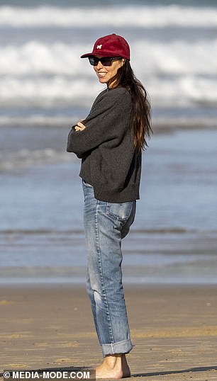 Erica went barefoot during her therapeutic beach walk, her $1,400 sneakers nowhere to be seen