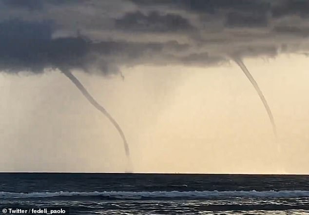 Authorities and experts have said the ship was hit by a waterspout - a swirling column of air and water mist. Pictured, waterspouts in Fregenae, Italy on the same day as Bayesian yacht disaster