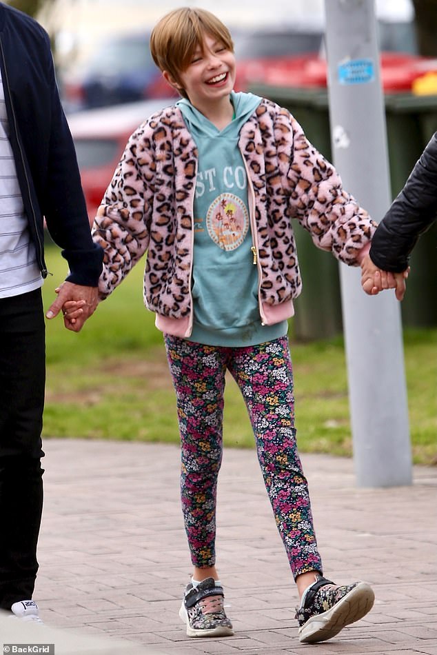 Ruby looked colorful in a pair of floral tights, a light blue hoodie and a pink leopard print zip-up jacket