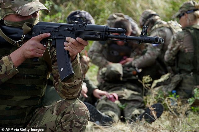 Doctors, volunteers and military personnel undergo tactical training, including first aid and simulation of the evacuation of a wounded comrade, in the southern Russian region of Rostov