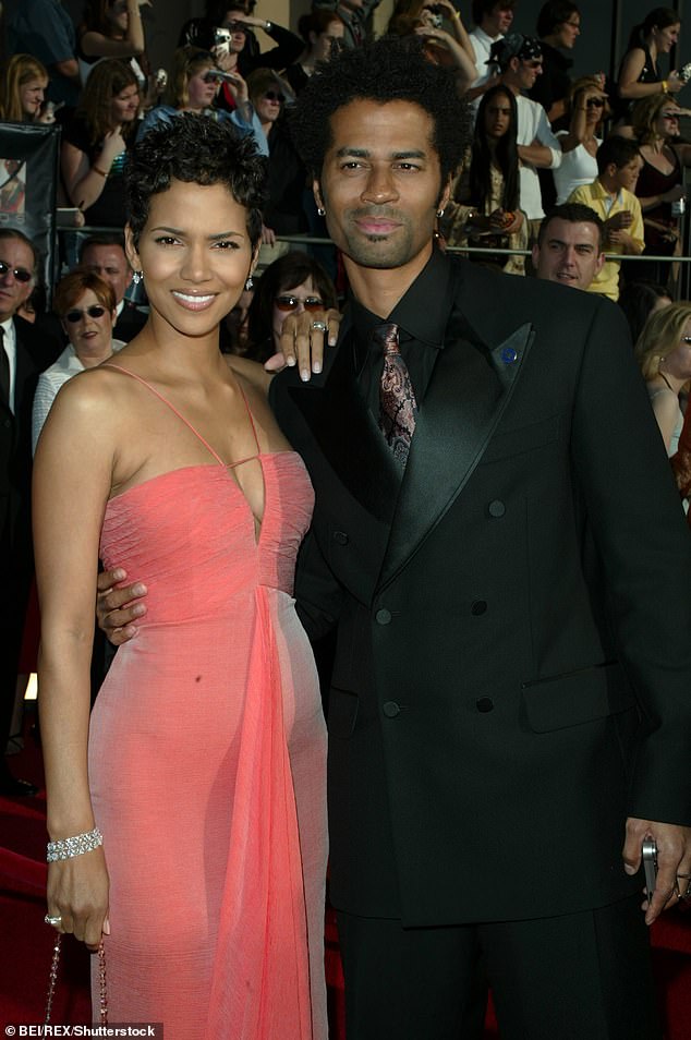 Between 1999 and 2003, Berry had a relationship with Eric Benet, whom she had to confront about his infidelity during the filming of Die Another Day in London (pictured in March 2003).