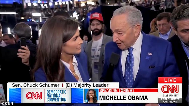 The conservative commentator faded into the background of an interview with Senate Majority Leader Chuck Schumer before being led away