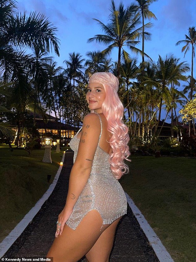 Pictured: Hollie Marie in a pink wig to hide her hair loss