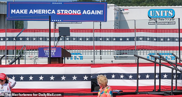 The bulletproof glass screen is placed around the stage ahead of Trump's first rally