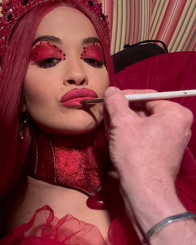 The Hot Right No singer shared a clip of herself getting her makeup touched up while reclining in a striped armchair and giving the camera a smoldering look