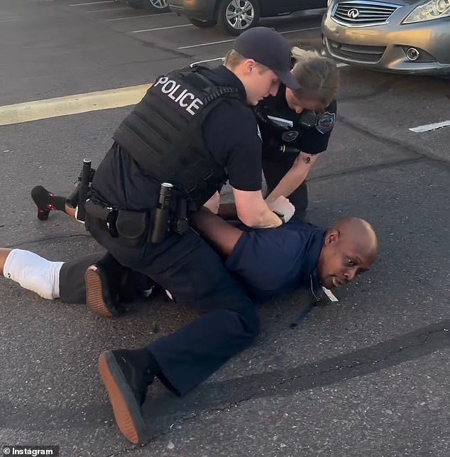 Footage captured by a bystander shows Cockrell screaming in protest as both officers hold his hands behind his back and handcuff him.